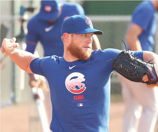  ?? JOHN ANTONOFF/SUN-TIMES ?? Manager David Ross praised Craig Kimbrel before the reliever served up a two-run home run to Willson Contreras in an intrasquad scrimmage Tuesday.