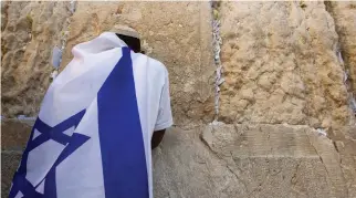  ??  ?? A JEWISH man prays at the Western Wall.