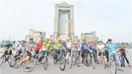  ??  ?? Musa with some of the cyclists joining him on the monthly Sunday Family Ride which was organised by the Ministry of Community Developmen­t and Consumer Affairs.