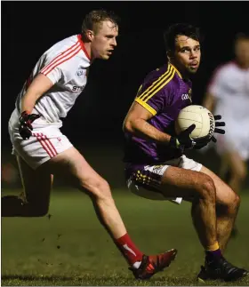  ??  ?? Newcomer Conor Devitt taking on Jim McEneaney of Louth.