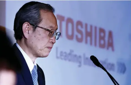  ?? SHIZUO KAMBAYASHI/THE ASSOCIATED PRESS ?? Toshiba Corp. president Satoshi Tsunakawa speaks during a press conference at the company’s headquarte­rs in Tokyo on Tuesday.