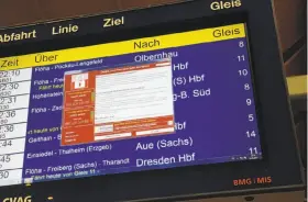  ?? P. Goetzelt / Deutsche Presse-Agentur ?? An error message appears on a display Friday at the train station in Chemnitz, Germany. The nation’s national railway was among entities hit by the attack.