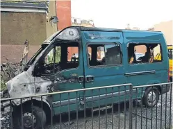  ?? Picture: Steve Macdougall. ?? The Inclusion Group’s minibus which was set on fire in Dundee. Manager Fiona Flynn, right, said they will now have to pay for taxis for service users.