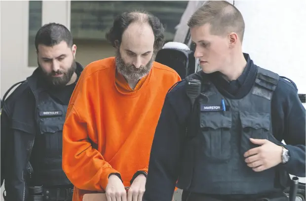  ?? Andrew Vaughan / THE CANADIAN PRESS files ?? Matthew Vincent Raymond, pictured being escorted from a Fredericto­n courthouse last year, is being tried for first- degree murder in the August
2018 shootings of four people. Const. Brett Arbeau, an officer who arrived at the scene of the shootings, testified at the trial on Monday.