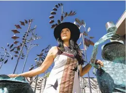  ?? HAYNE PALMOUR IV FOR THE U-T ?? Indigenous entreprene­ur Ruth-ann Thorn stands among sculptures at her gallery, Exclusive Collection­s, in Solana Beach.