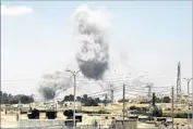  ?? Delil Souleiman AFP/Getty Images ?? SMOKE billows from buildings in the Syrian city of Raqqah during an offensive by U.S.-backed fighters.