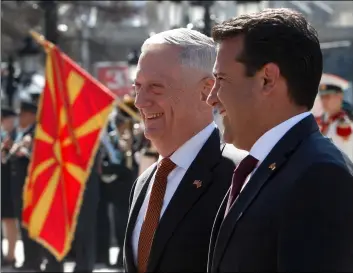  ??  ?? U.S. Defense Secretary James Mattis (center) is welcomed by Macedonian Prime Minister Zoran Zaev (right) upon his arrival at the government building Skopje, Macedonia, on Monday. AP PhoTo/BorIS GrdAnoSkI