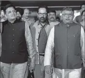  ??  ?? BJP and Congress leaders come out of the Election Commission of India office in New Delhi on Tuesday.