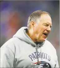  ?? Paul Sancya / Associated Press ?? New England Patriots head coach Bill Belichick walks on the sidelines during the second half against the Detroit Lions on Sunday in Detroit.