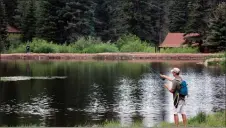  ?? COURTESY NEW MEXICO TOURISM DEPARTMENT ?? A fisherman casts his line at Monastery Lake, which reopened March 5. Monastery Lake is located near the Village of Pecos.