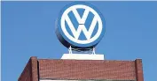  ??  ?? The VW logo is seen at the company’s headquarte­rs at the Volkswagen plant in Wolfsburg, Germany.