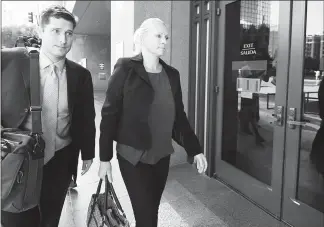  ?? DENIS POROY / AP ?? Margaret Hunter, right, the wife of U.S. Rep. Duncan Hunter, arrives for her arraignmen­t hearing Thursday.