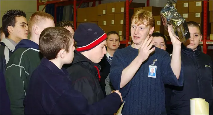  ??  ?? Colin Byrne, Quantum gives a guided tour to Colaiste Ris students during their visit to Quantum as part of the Young Achievemen­t/Young Enterprise “Economics of Staying at School” programme.