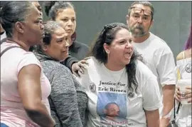  ?? Irfan Khan Los Angeles Times ?? VALERIE RIVERA shouts at officers after the Police Commission’s finding Tuesday. Her son, Eric Rivera, 20, was killed by police in Wilmington last June.