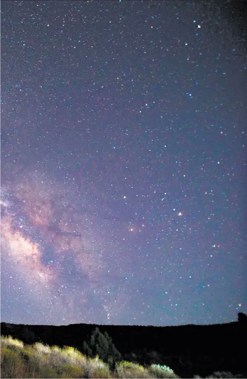  ?? Photos by Sam Watson / Special to The Chronicle ?? Top: Camping under the Milky Way in Canyonland­s National Park in Utah. Canyonland­s has one of the darkest skies in North America, making stargazing from campsites a highlight of any trip. Far left: In the daytime, White Rim cyclists are greeted with a...