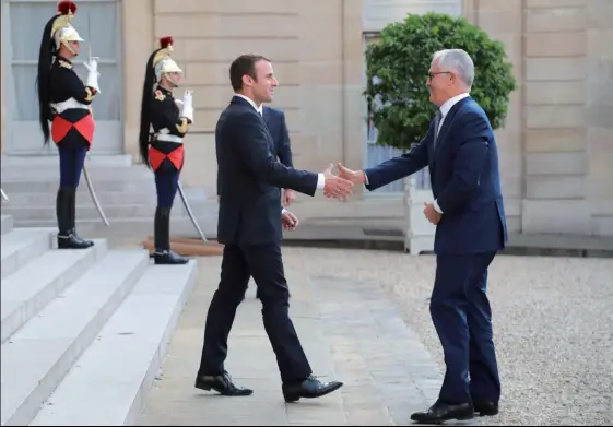  ?? (© AFP/ Jacques Demarthon) ?? Photo ci-dessus : Le 8 juillet 2017, Emmanuel Macron reçoit le Premier ministre australien Malcolm Turnbull au Palais de l’Elysée.