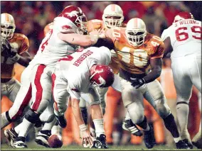  ?? Arkansas Democrat-Gazette/DAVID GOTTSCHALK ?? Arkansas’ Clint Stoerner fumbles the ball in the closing minutes of play against Tennessee turning the ball over in Knoxville on Nov. 14, 1998.