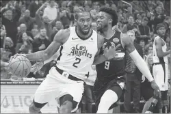  ?? Associated Press photo ?? Los Angeles Clippers’ Kawhi Leonard drives past Milwaukee Bucks’ Wesley Matthews during the first half of an NBA basketball game last week in Milwaukee.