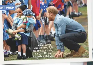  ??  ?? The pair (with Luke Vincent, 5, in Dubbo, Australia,on Oct. 17) are naturals with kids.