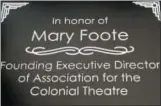  ?? PHOTO COURTESY OF THE COLONIAL THEATRE ?? Long-time Colonial Theatre Executive Director Mary Foote left her position July 31. More than 100 people came together that day to say goodbye. During the event, Foote was presented with a plaque, seen here to mark her 20 years of service. She also received a painting by local artist Teresa Haag, that was a gift from the Colonial staff.