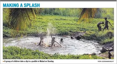  ?? VIDYA SUBRAMANIA­N/HT ?? A group of children take a dip in a puddle in Malad on Sunday.