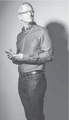  ??  ?? Apple CEO Tim Cook poses for a portrait at Apple’s global headquarte­rs in Cupertino, California on July 28. Cook has been CEO for five years; he took over for Steve Jobs shortly before Jobs’ death. — WP-Bloomberg photo