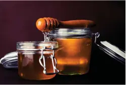  ??  ?? KITCHEN CURE: The shelves in your kitchen are filled with the ingredient­s that work wonders on your skin, such as honey.