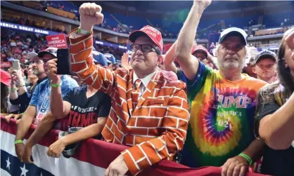  ?? Photograph: Nicholas Kamm/ AFP/Getty Images ?? Trump supporters at the recent rally in Tulsa, Oklahoma. The empty upper-tier stands are clearly visible.