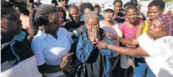  ?? Picture: Esa Alexander ?? Nomaza Nomandela, centre, was part of a group of protesters who invaded land in Hermanus. She also received an SMS demanding she pay rates.