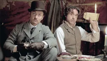  ?? PICTURE: REUTERS/AFRICAN NEWS AGENCY (ANA) ?? OUT OF THE SHADOWS: Actors Jude Law, as Dr Watson, and Robert Downey Jr, as Sherlock Holmes, in a scene from the action adventure mystery Sherlock Holmes: A Game Of Shadows.