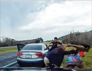  ?? MADISON COUNTY SHERIFF’S OFFICE 2015 ?? These still images from the dashcam of Madison County Deputy Doug Haskell show Janetta Edwards as she is pulled out of her car and shoved down an I-10 embankment by Deputy Bobby Boatwright in February 2015. Prosecutor Dean Morphonios declined to prosecute.