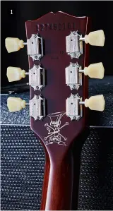  ??  ?? 1. Note the nine-digit serial number, Slash’s ‘Scully’ cartoon, ‘keystone’ pegs on vintage-style tuners and a fetching dark cherry finish on the back of the neck (and body) 1