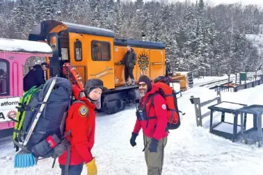  ?? SGT. GLEN LUCAS/NEW HAMPSHIRE FISH AND GAME VIA AP ?? On Feb. 17, New Hampshire Fish and Game conservati­on officer Levi Frye, left, and Jeremy Broughton, from Androscogg­in Valley Search and Rescue, prepare to head out on a rescue mission at the Cog Railway base station.