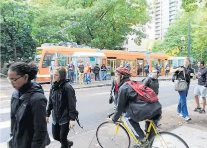  ?? COURTESY OF PORTLAND STREETCAR ?? Orange County wants to study the feasibilit­y of streetcars on a stretch of Internatio­nal Drive that could look like these in Portland.