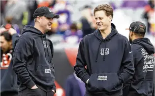  ?? JAY LAPRETE / AP ?? Bengals head coach Zac Taylor (left) says quarterbac­k Joe Burrow (right) is on track toward participat­ing in on-field work once Organized Team Activities begin at the end of May.