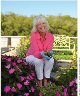  ??  ?? Avid gardener Jane Johnston tends her flowers on The Island at Shell Point.