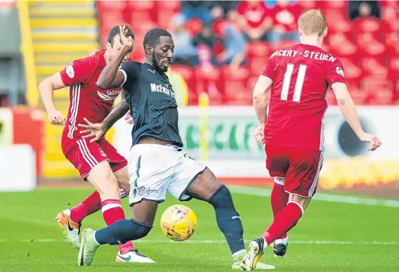  ??  ?? Dundee turned in a good performanc­e at Pittodrie but still came away empty-handed as the Dons won 2-1.