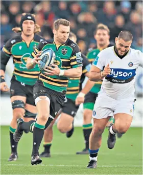  ?? ?? Rout: Dan Biggar breaks with the ball as Northampto­n Saints inflict more pain on Bath