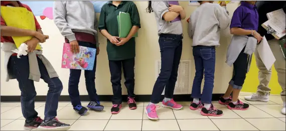  ?? ERIC GAY FILE — THE ASSOCIATED PRESS ?? Migrant teens line up for a class at a “tender-age” facility for babies, children and teens, in Texas’ Rio Grande Valley Aug. 29, 2019in San Benito, Texas.