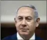  ?? RONEN ZVULUN VIA AP, FILE ?? Israeli Prime Minister Benjamin Netanyahu chairs the weekly cabinet meeting at the Prime Minister’s office in Jerusalem. Israeli media reports Tuesday say police recommendi­ng Netanyahu indictment on corruption charges, including bribery.