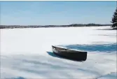  ?? SPECIAL TO THE EXAMINER ?? Guess when the ice goes and this tethered canoe floats freely in the lake atCamp Kawartha and you could win a Nature Camp session for a child in your life.