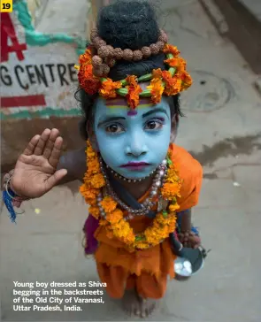  ?? ?? Young boy dressed as Shiva begging in the backstreet­s of the Old City of Varanasi, Uttar Pradesh, India.