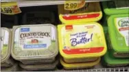  ?? THE ASSOCIATED PRESS ?? Containers of I Can’t Believe It’s Not Butter and Country Crock spreads appear on display in a grocery store cooler in Bellevue, Wash.