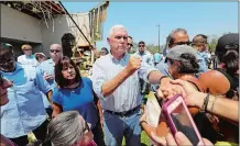  ?? ERIC GAY/AP PHOTO ?? Vice President Mike Pence, center, and his wife, Karen, left, greet residents affected by Hurricane Harvey during a visit Thursday in Rockport, Texas.