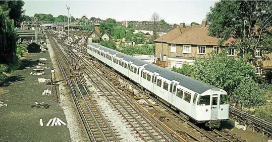  ??  ?? A four-car train of 1967 Stock worked the Woodford shuttle until 1984. One such set is pictured reversing at Woodford in June 1976 prior to working back to Hainault.