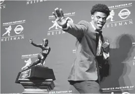  ?? JULIE JACOBSON/AP ?? For all the star football players who have come out of Broward and Palm Beach counties, it’s hard to believe none had ever hoisted college football’s most prestigiou­s prize. Lamar Jackson ended both droughts when he won the Heisman Trophy after a sensationa­l sophomore season as Louisville’s dual-threat quarterbac­k in 2016.