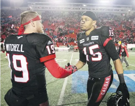  ?? JIM WELLS ?? Calgary Stampeders quarterbac­k Bo Levi Mitchell, left, connected with receiver Eric Rogers for three touchdowns in their 22-14 win over the Winnipeg Blue Bombers in Sunday’s West Division Final at McMahon Stadium, propelling the Stampeders to their third consecutiv­e Grey Cup game.