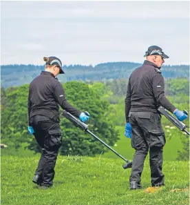  ?? Picture: Steve MacDougall. ?? Police search alongside Maggie Wall’s monument near Dunning yesterday.