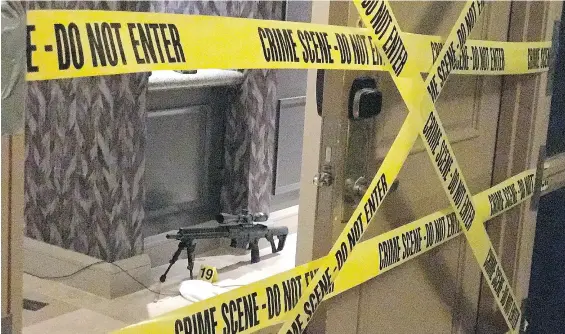  ?? BILD EXCLUSIVE / POLARIS ?? Caution tape cordons off Stephen Paddock’s 32nd-floor suite at the Mandalay Bay Resort and Casino in Las Vegas. Police believe Paddock, who checked into his room without suspicion on Thursday, used 10 suitcases to carry his guns.