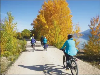  ?? J.P. SQUIRE/Special to The Okanagan Weekend ?? The Okanagan Rail Trail between Oyama and Coldstream is lined with deciduous trees with their brilliant fall colours at this time of year. Freezing or near-freezing overnight temperatur­es have meant the removal of portable toilets, however. Cyclists are hoping permanent toilets can be installed next year.